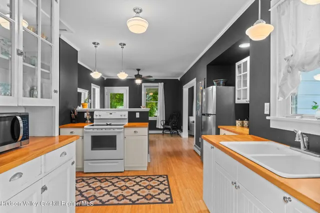 a kitchen with granite countertop a refrigerator and a stove