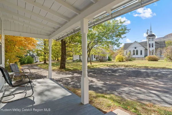 a big house with a big yard and large trees