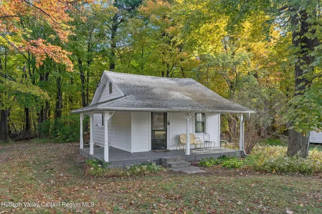 a living room with furniture and window