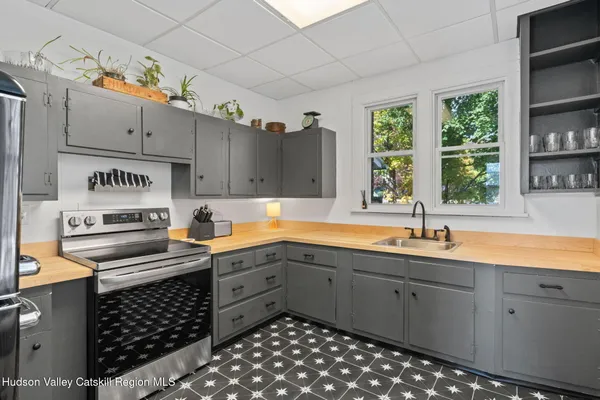 a kitchen with sink cabinets and window