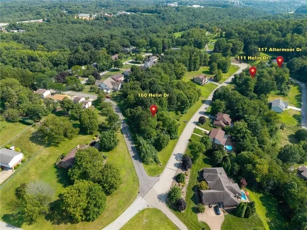 an aerial view of residential house with outdoor space and swimming pool