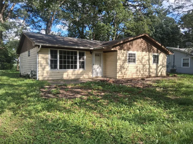 a front view of a house with yard