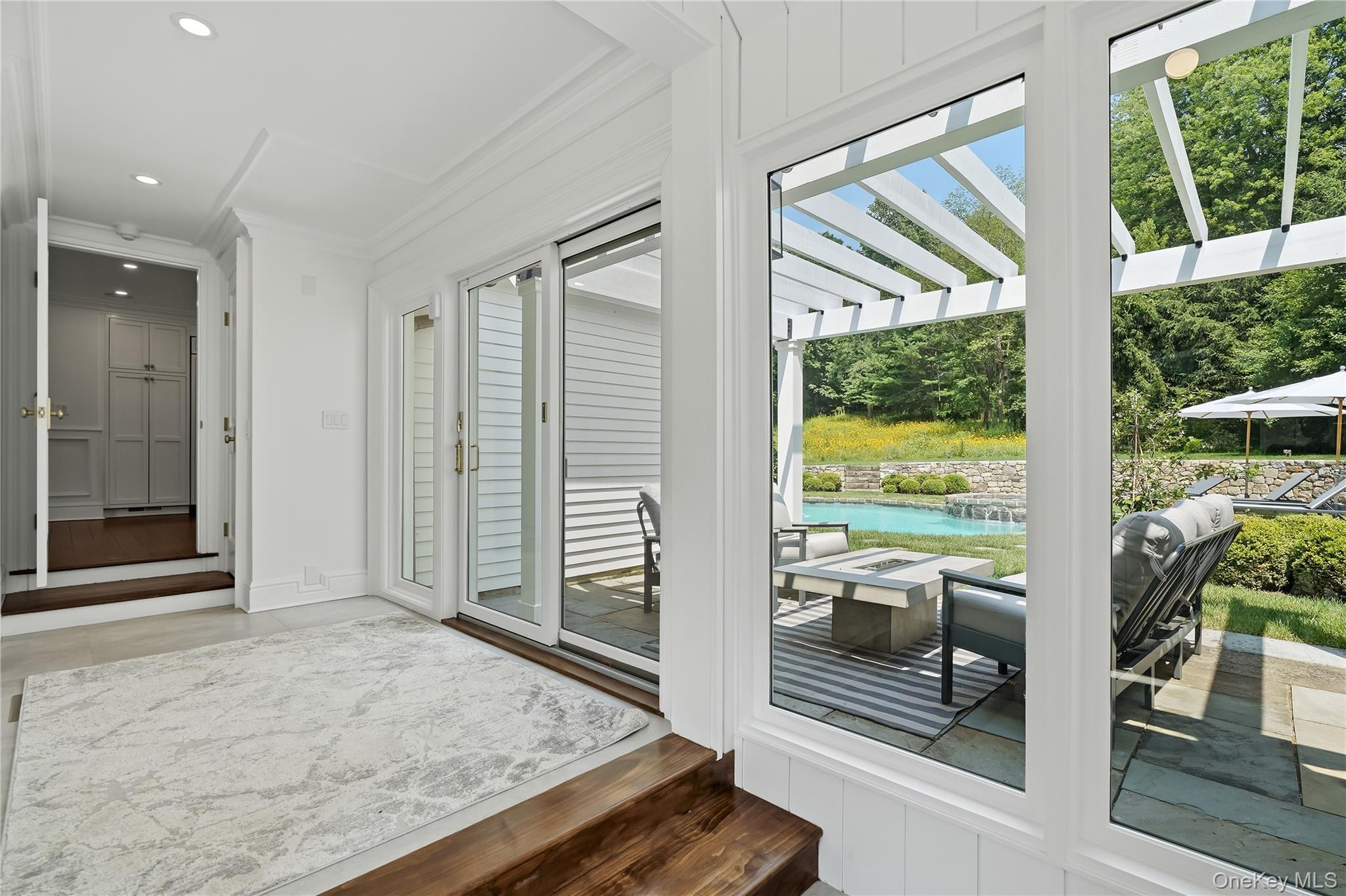 79 Cross River Road Pound Ridge, NY 10576 - Photo 7 of 34 Mudroom with glass sliders to the pool area