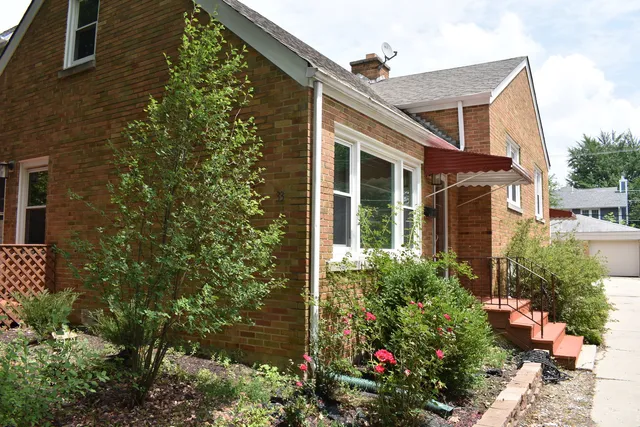 front view of a house with a small yard