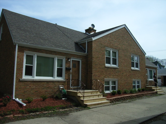 33 North Spring Avenue, Unit FRONT La Grange, IL 60525 - Photo 2 of 11 a front view of a house with a yard