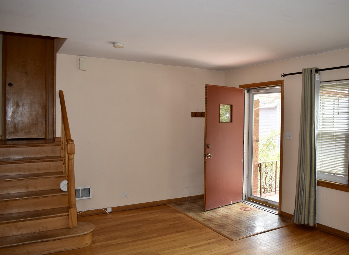 33 North Spring Avenue, Unit FRONT La Grange, IL 60525 - Photo 4 of 11 a view of an empty room with wooden floor and a window
