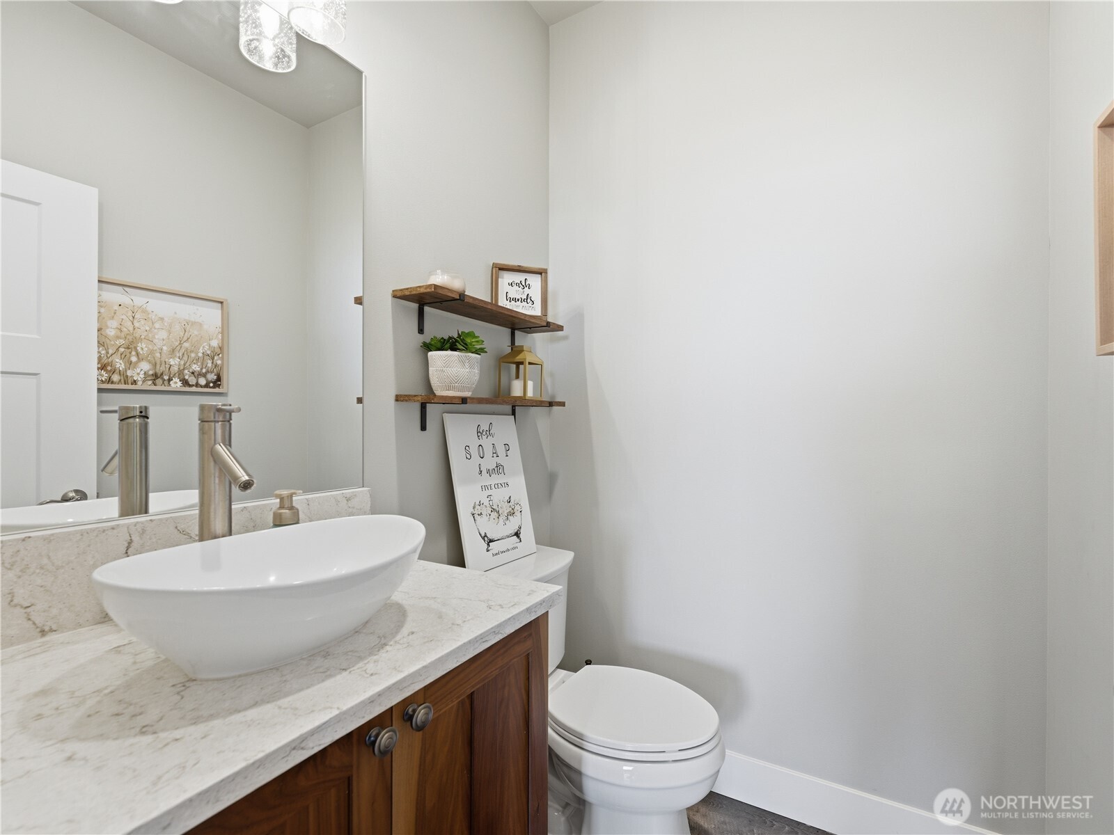 2128 McEldowney Road Malaga, WA 98828 - Photo 17 of 39 a bathroom with a granite countertop toilet sink and mirror
