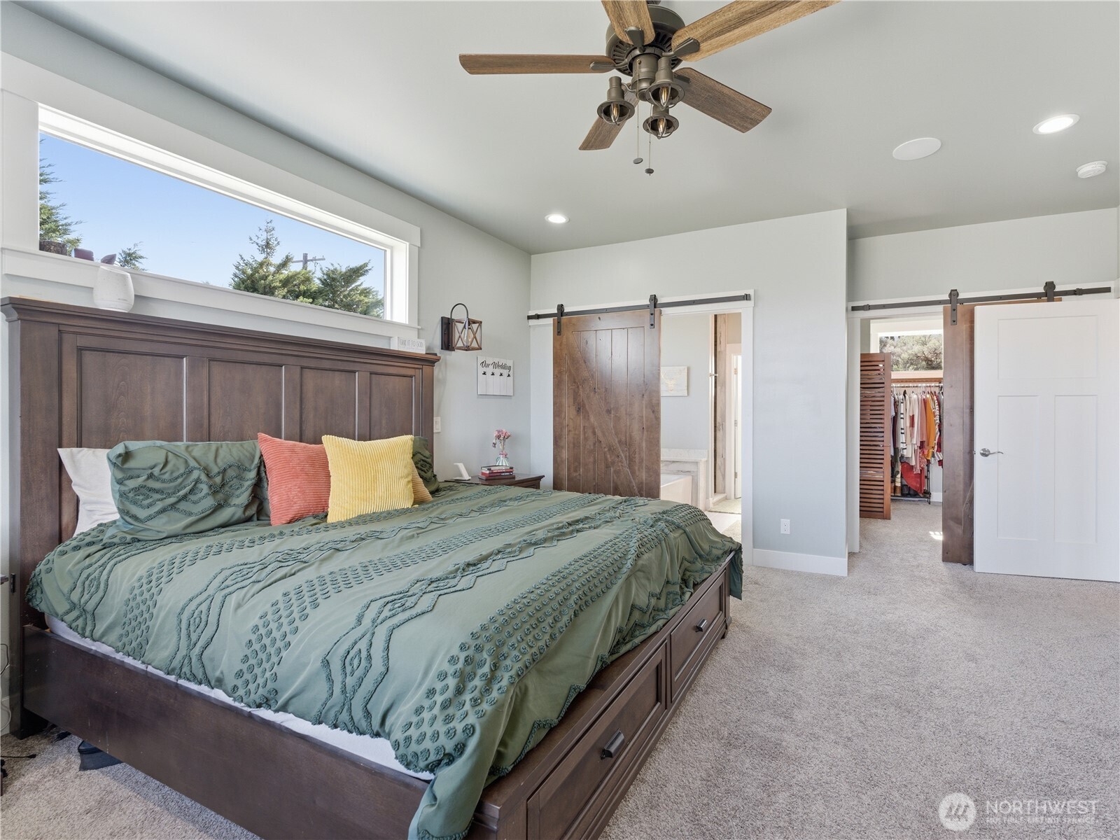 2128 McEldowney Road Malaga, WA 98828 - Photo 19 of 39 a bedroom with a large bed and ceiling fan