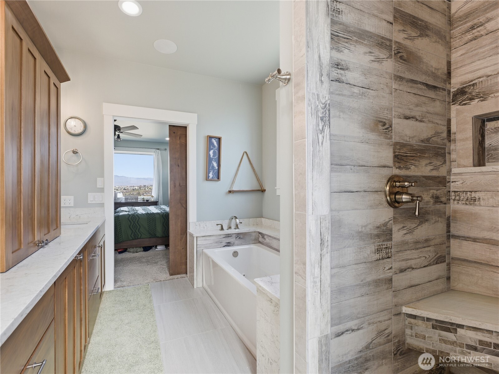 2128 McEldowney Road Malaga, WA 98828 - Photo 22 of 39 a bathroom with a tub sink and mirror