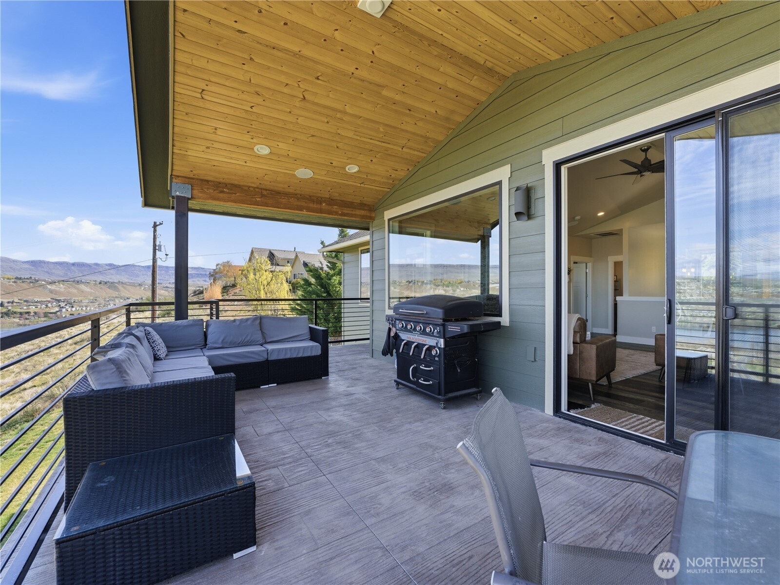 2128 McEldowney Road Malaga, WA 98828 - Photo 24 of 39 a building outdoor space with patio furniture and a potted plant