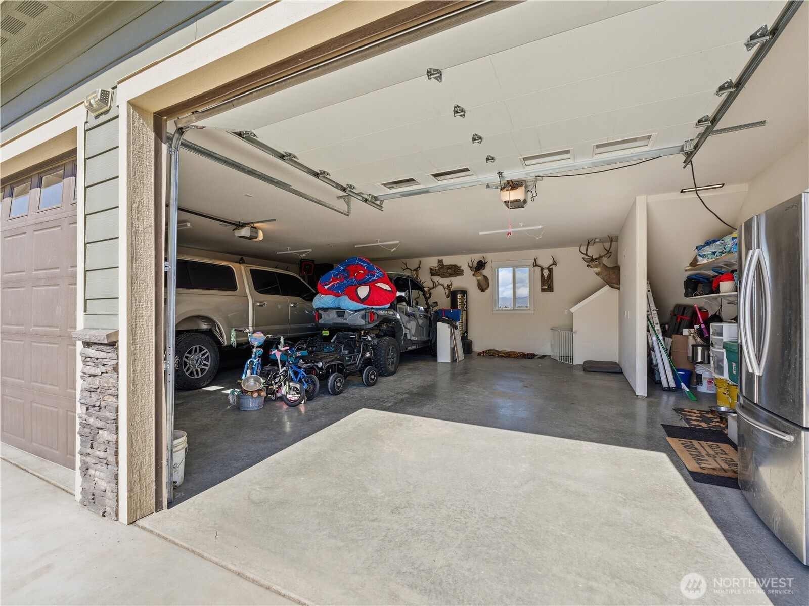 2128 McEldowney Road Malaga, WA 98828 - Photo 37 of 39 a view of a garage with a bike and car
