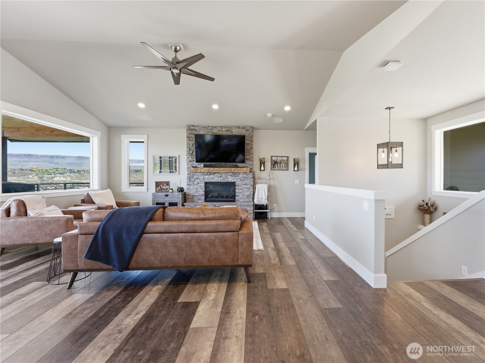 2128 McEldowney Road Malaga, WA 98828 - Photo 7 of 39 a living room with furniture and a fireplace