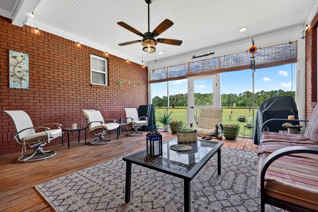 481-494 Sand Pit Road Mauk, GA 31058 - Photo 32 of 94 a living room with patio furniture and a large window
