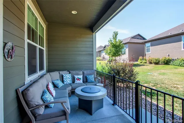 a outdoor living space with furniture and a potted plant