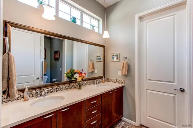 a bathroom with a toilet and shower