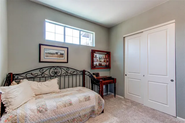 a bedroom with furniture and a window