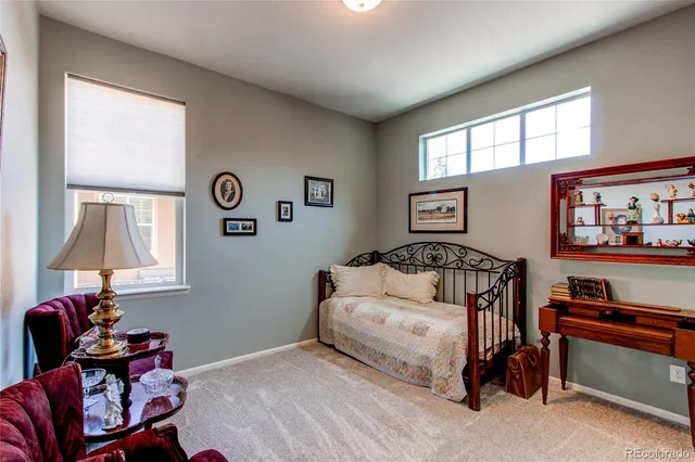 a bathroom with a sink a toilet a mirror a vanity and shower