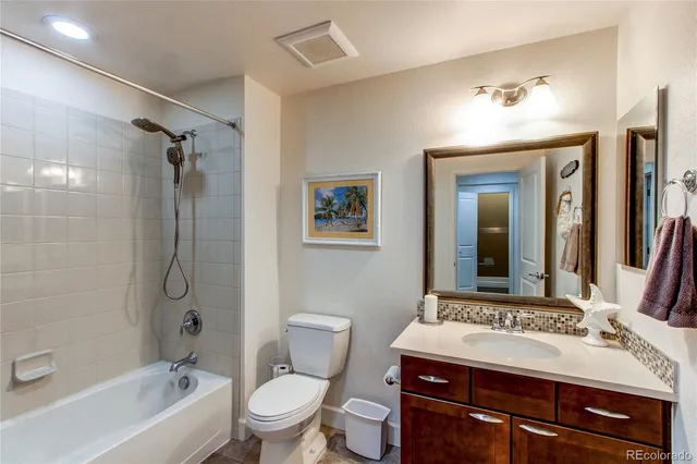 a bedroom with a bed a chair and a window