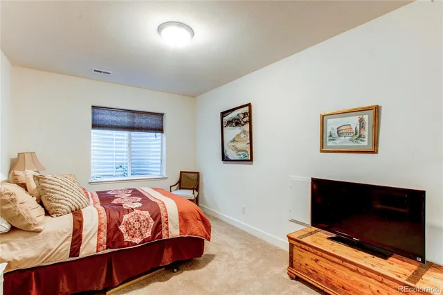 a bedroom with furniture and a couch