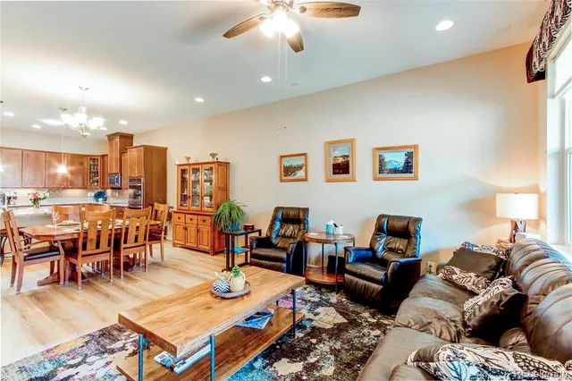 a living room with furniture kitchen view and a table