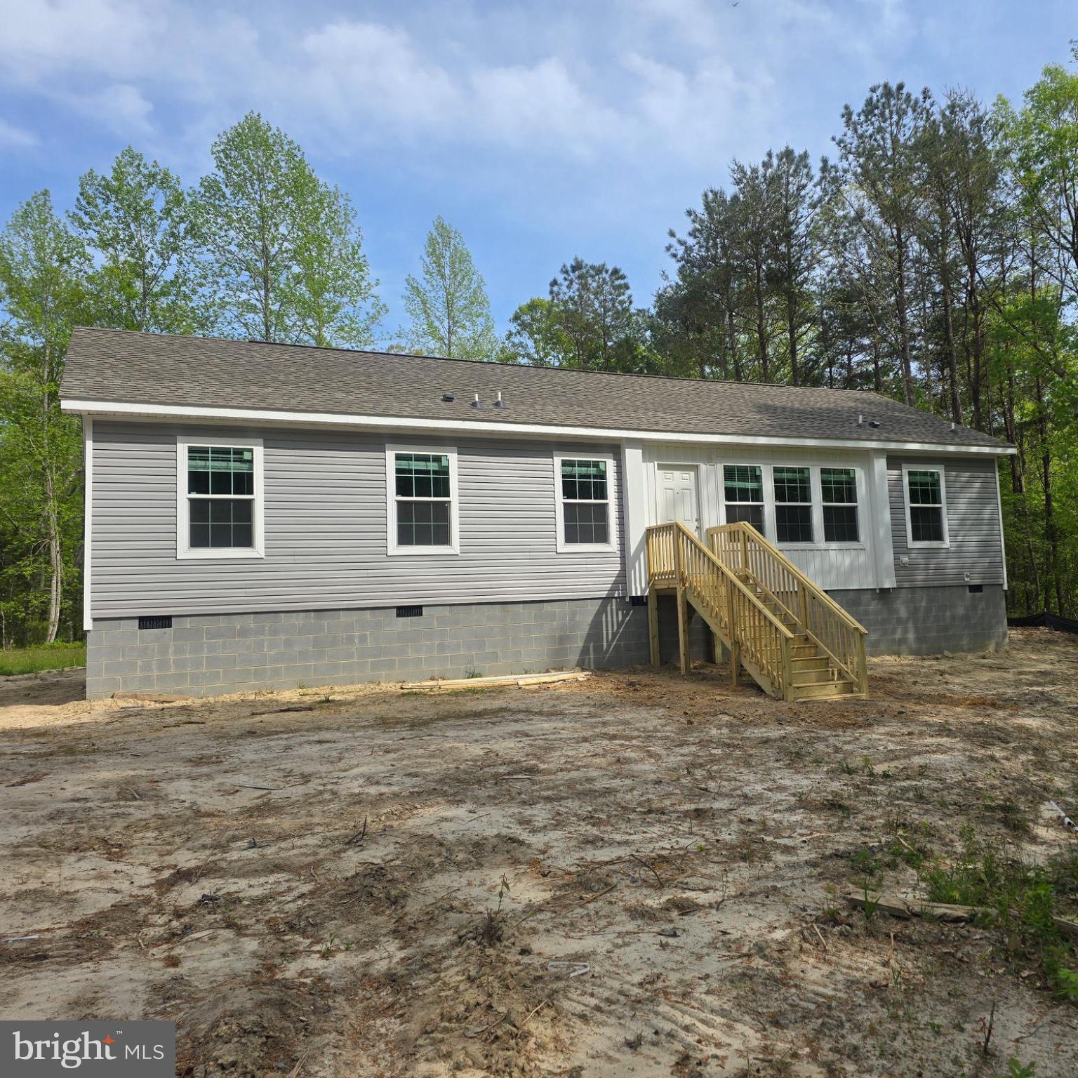 Charming new home in serene woods.