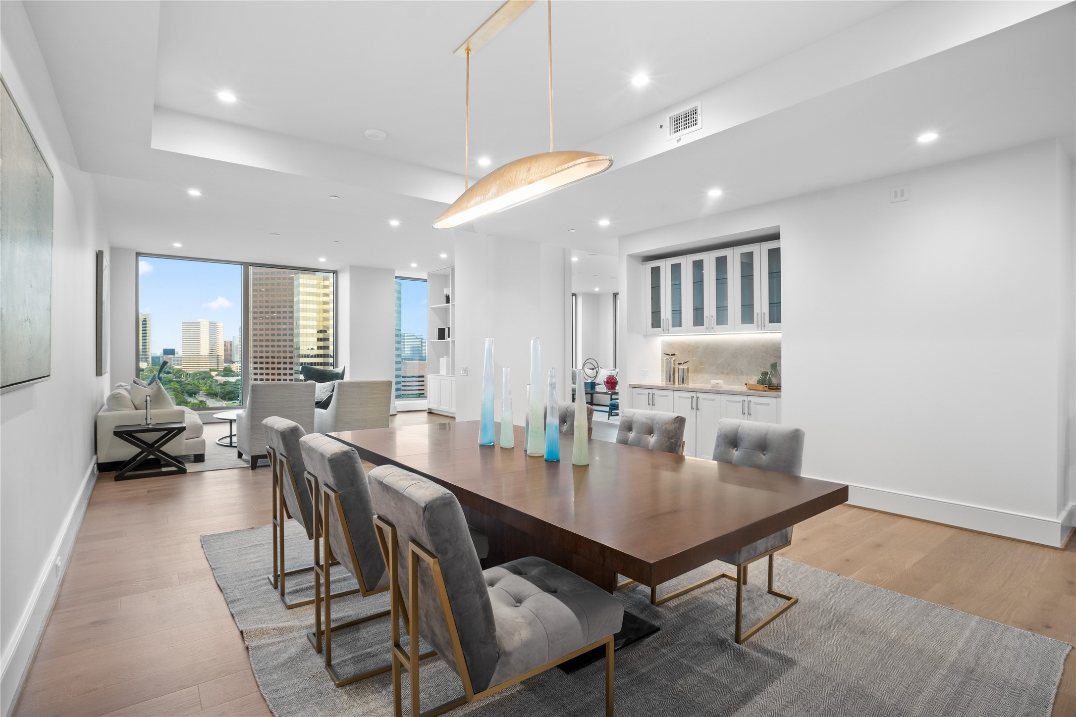 5656 San Felipe Street, Unit 1301 Houston, TX 77056 - Photo 14 of 30 a view of a a dining room with furniture window and wooden floor