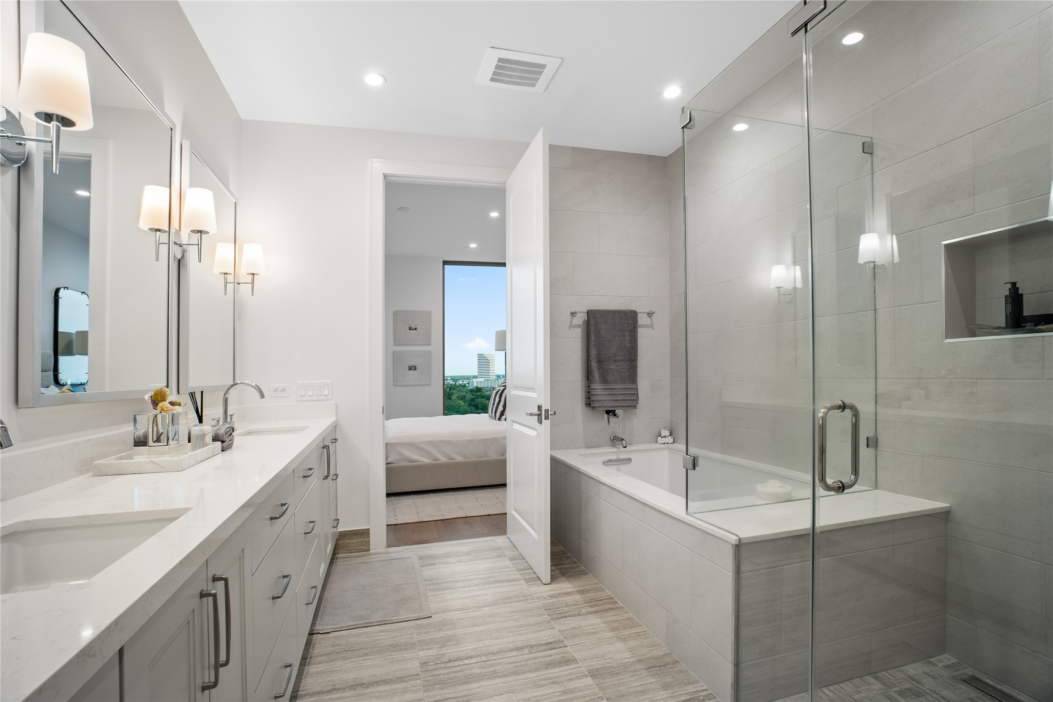 5656 San Felipe Street, Unit 1301 Houston, TX 77056 - Photo 18 of 30 a bathroom with a double vanity sink mirror and shower