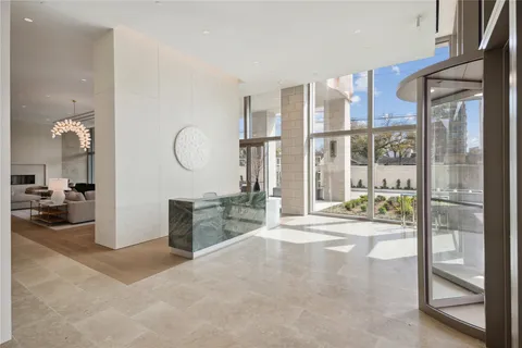 a very nice looking room with a large window and kitchen view