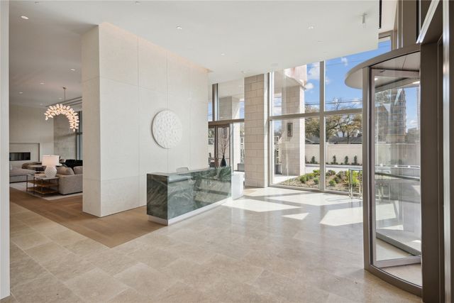 a very nice looking room with a large window and kitchen view