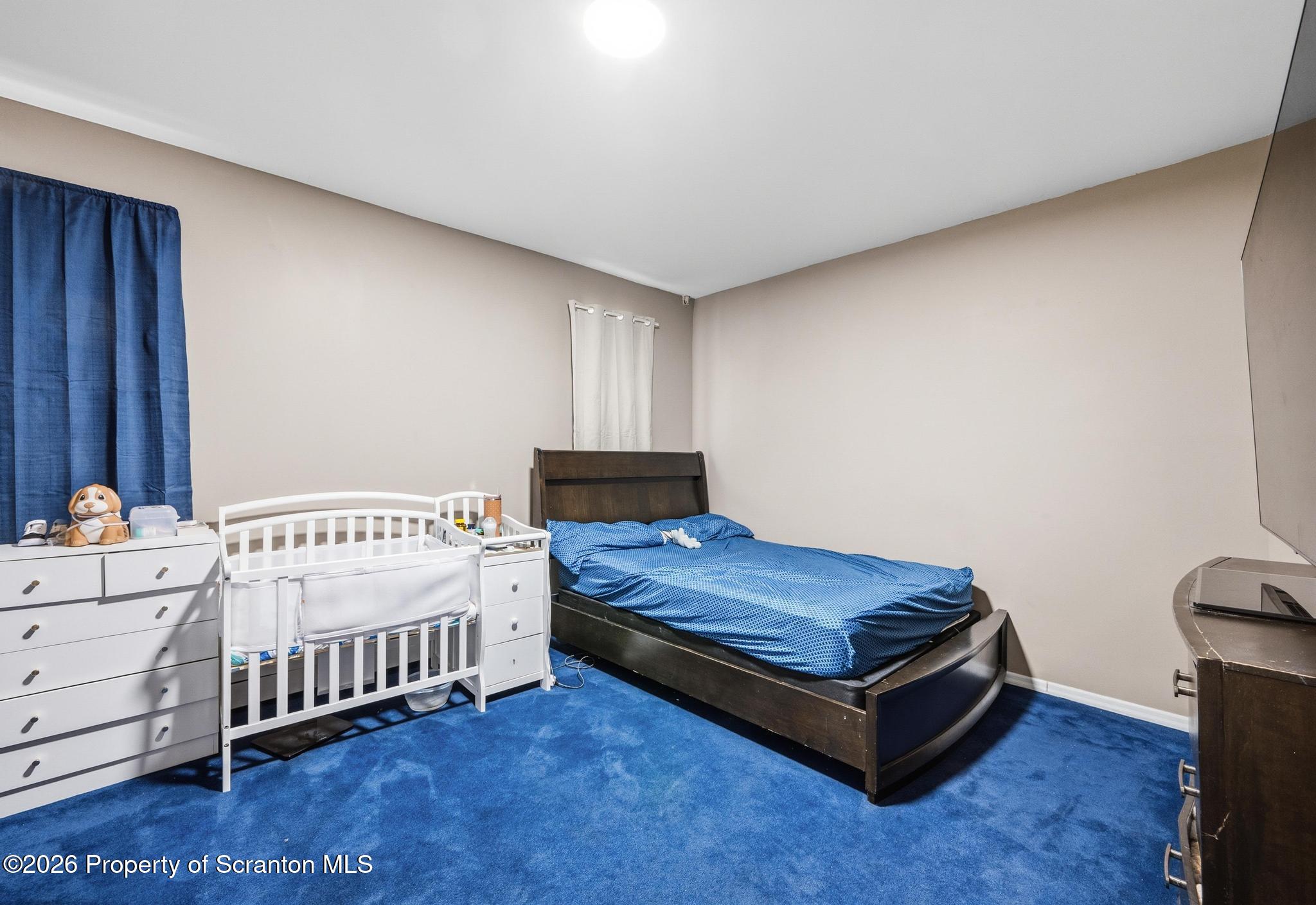 518 Prospect Avenue Scranton, PA 18505 - Photo 21 of 59 a bedroom with a bed and a window