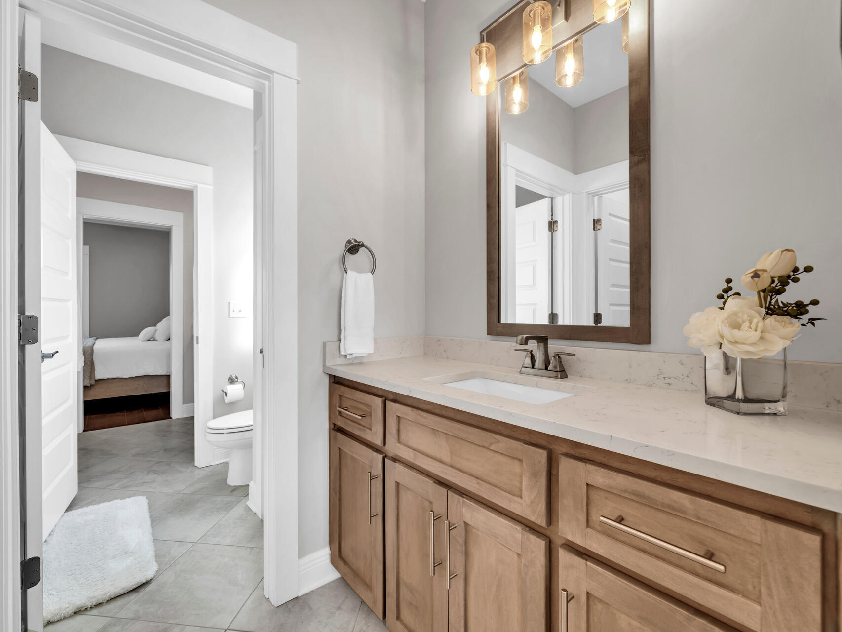 310 Mill Pond Cove Freeport, FL 32439 - Photo 12 of 49 a bathroom with a sink and a mirror