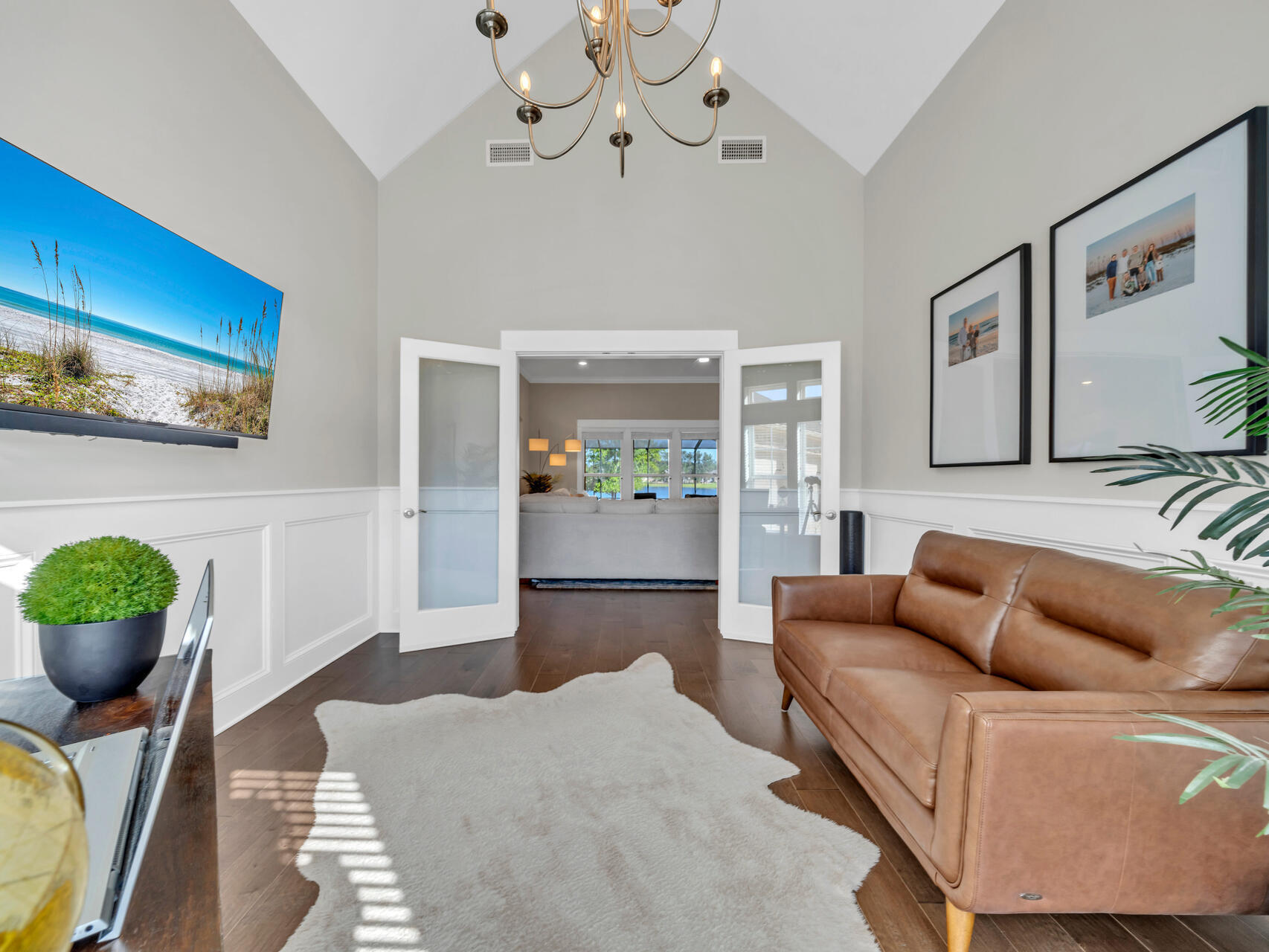 310 Mill Pond Cove Freeport, FL 32439 - Photo 17 of 49 a living room with furniture a chandelier and a dining room