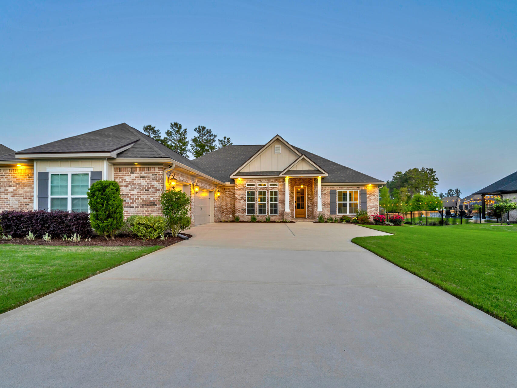 310 Mill Pond Cove Freeport, FL 32439 - Photo 2 of 49 a front view of a house with a yard and garage