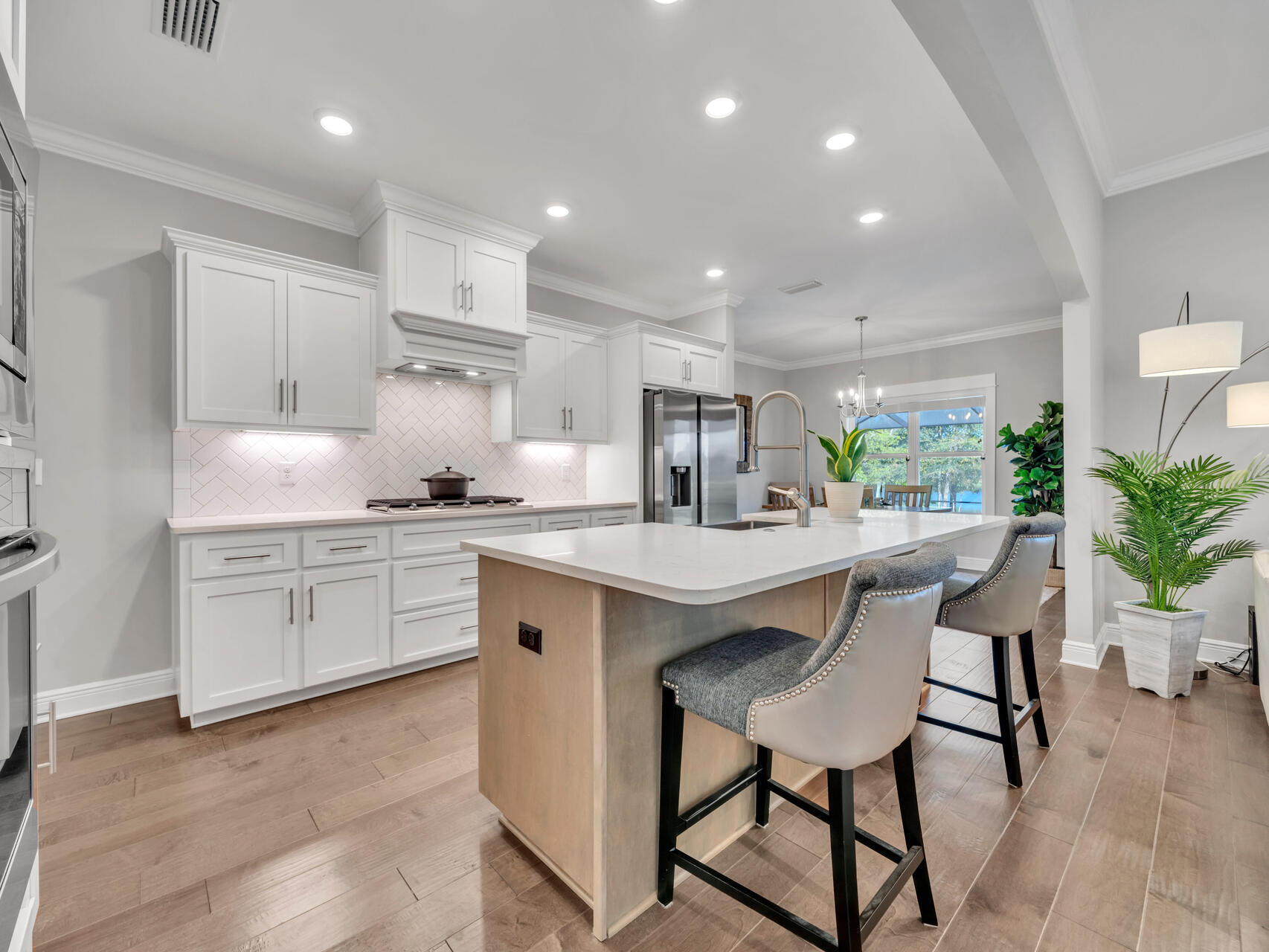 310 Mill Pond Cove Freeport, FL 32439 - Photo 21 of 49 a kitchen with granite countertop white cabinets and stainless steel appliances