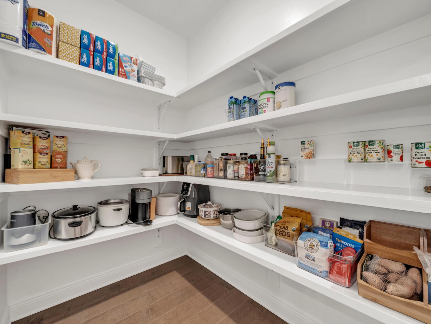 310 Mill Pond Cove Freeport, FL 32439 - Photo 23 of 49 a kitchen with a refrigerator a sink and a cabinets