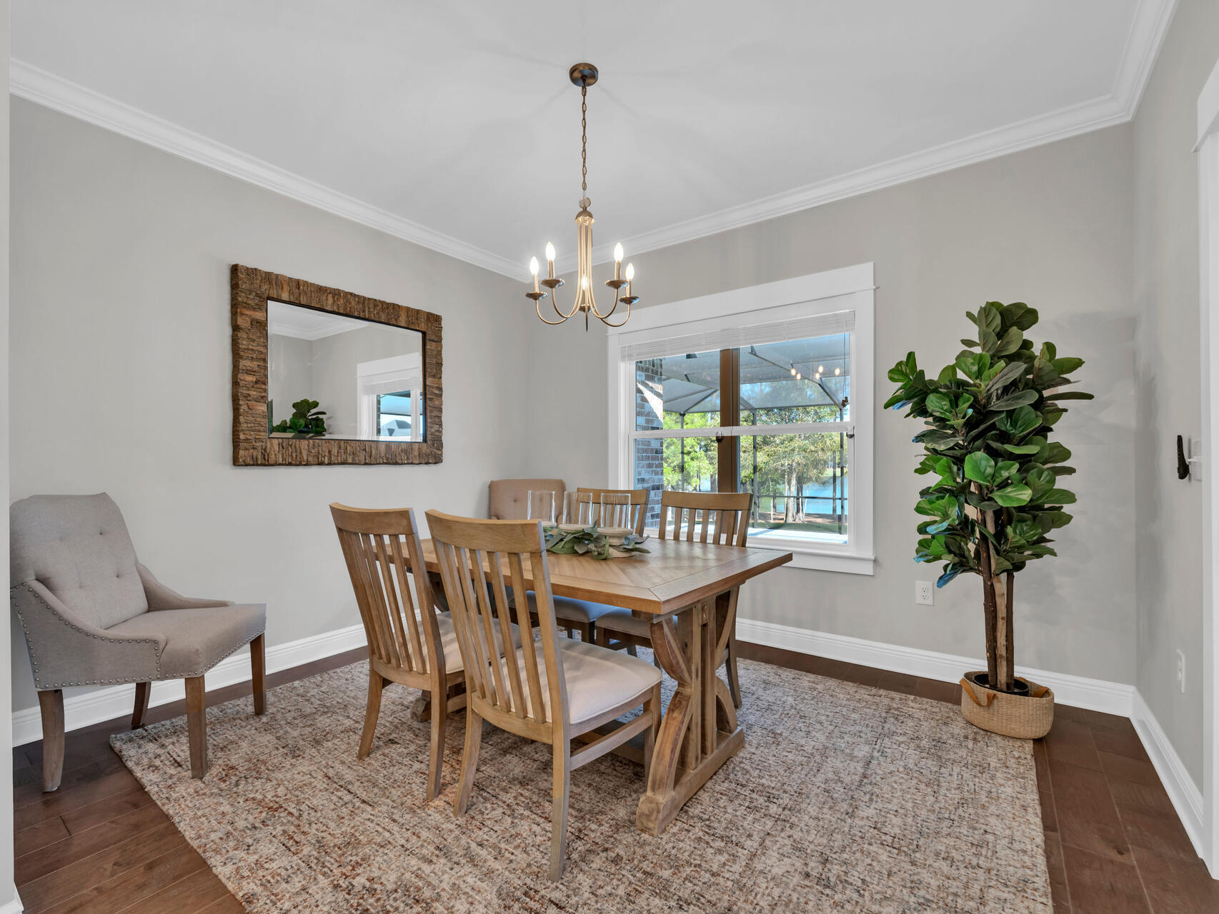 310 Mill Pond Cove Freeport, FL 32439 - Photo 24 of 49 a view of a dining room with furniture window and wooden floor