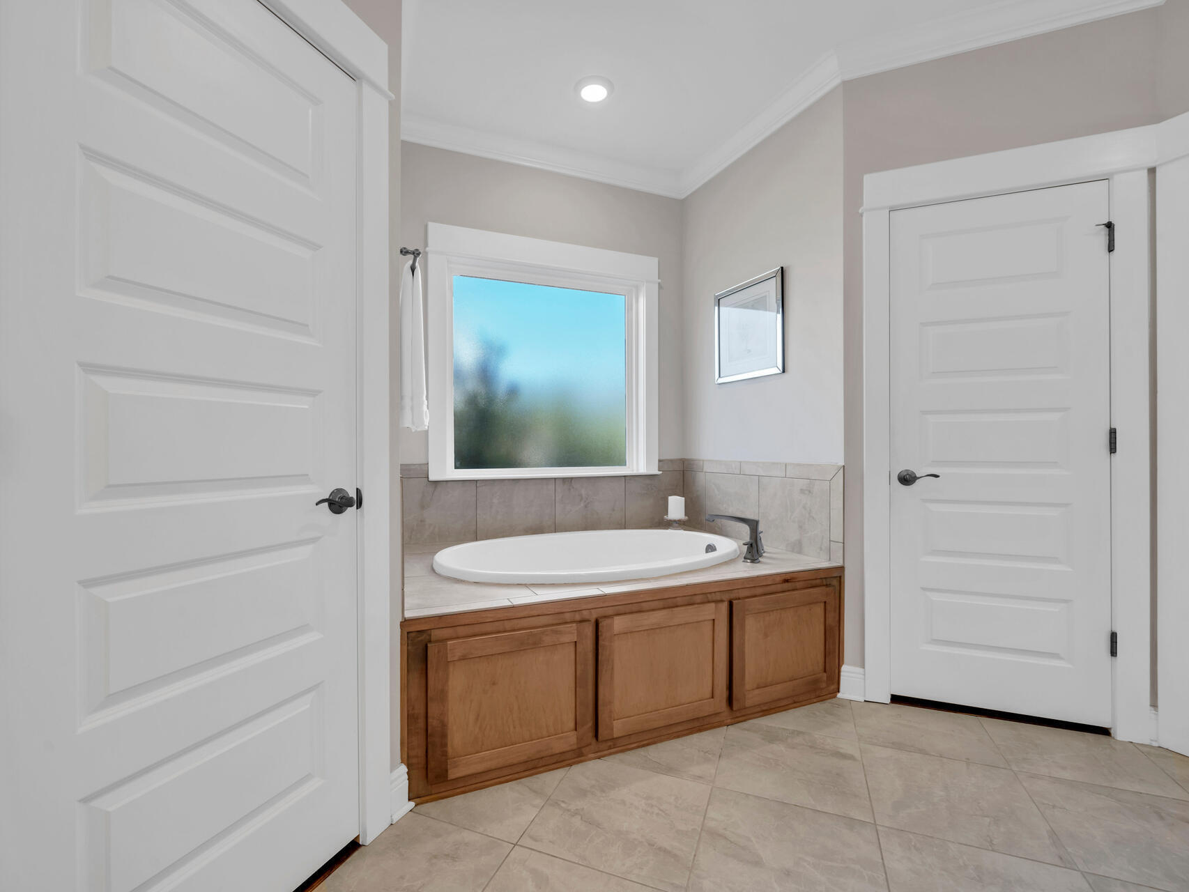 310 Mill Pond Cove Freeport, FL 32439 - Photo 28 of 49 a spacious bathroom with a double vanity sink a mirror and a bathtub