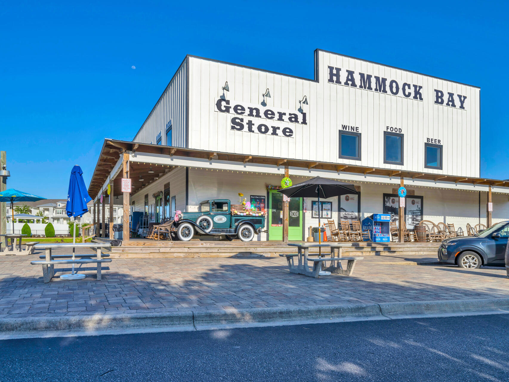 310 Mill Pond Cove Freeport, FL 32439 - Photo 45 of 49 a front view of a building with retail shops