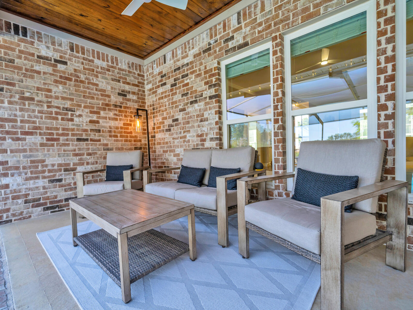 310 Mill Pond Cove Freeport, FL 32439 - Photo 6 of 49 a balcony with furniture and a fireplace