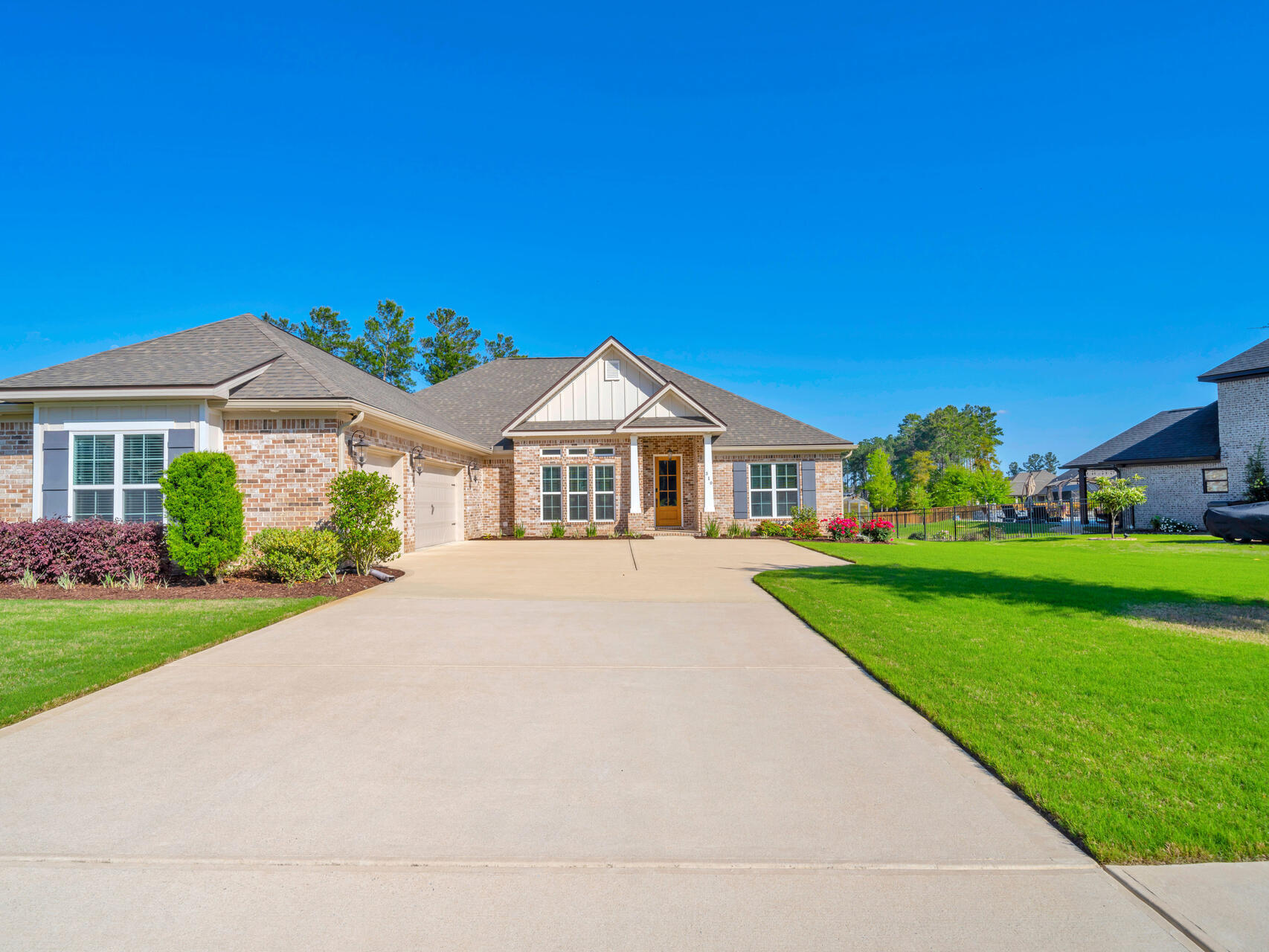 310 Mill Pond Cove Freeport, FL 32439 - Photo 7 of 49 a view of house with garden and tall trees