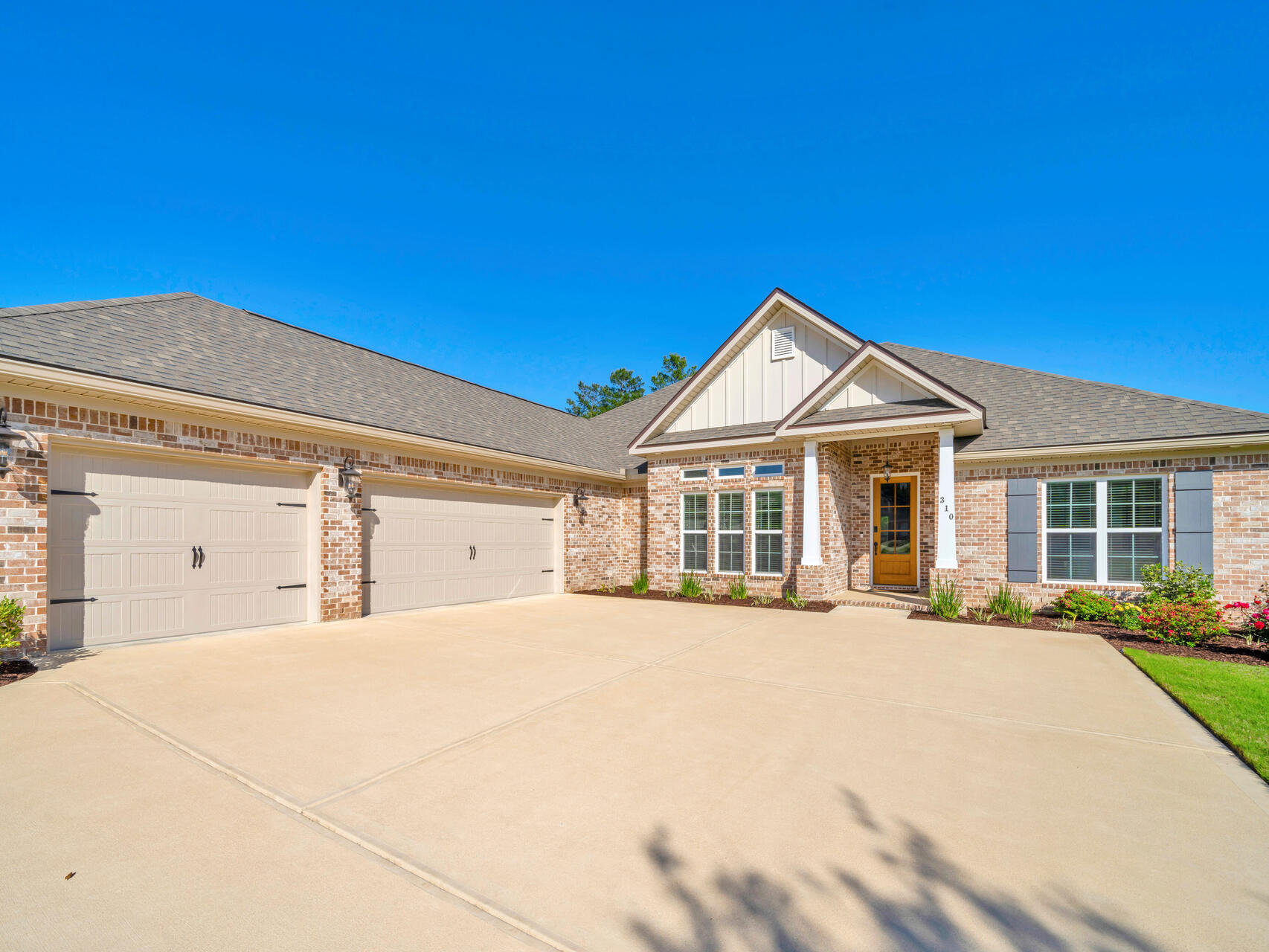 310 Mill Pond Cove Freeport, FL 32439 - Photo 8 of 49 a front view of a house with a yard