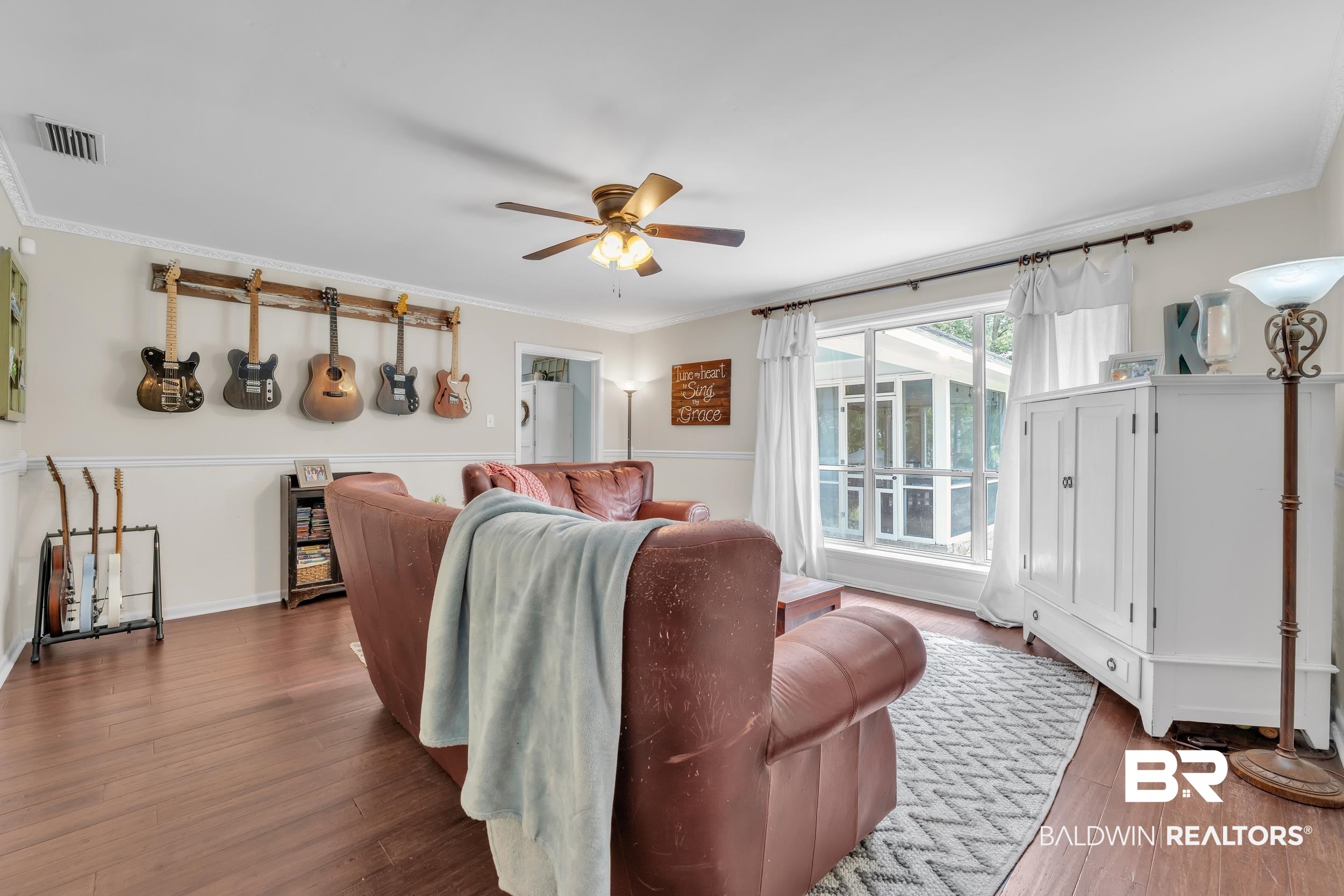 224 Cache Circle Mobile, AL 36611 - Photo 12 of 42 Living room with a ceiling fan, wood finished floors, and ornamental molding