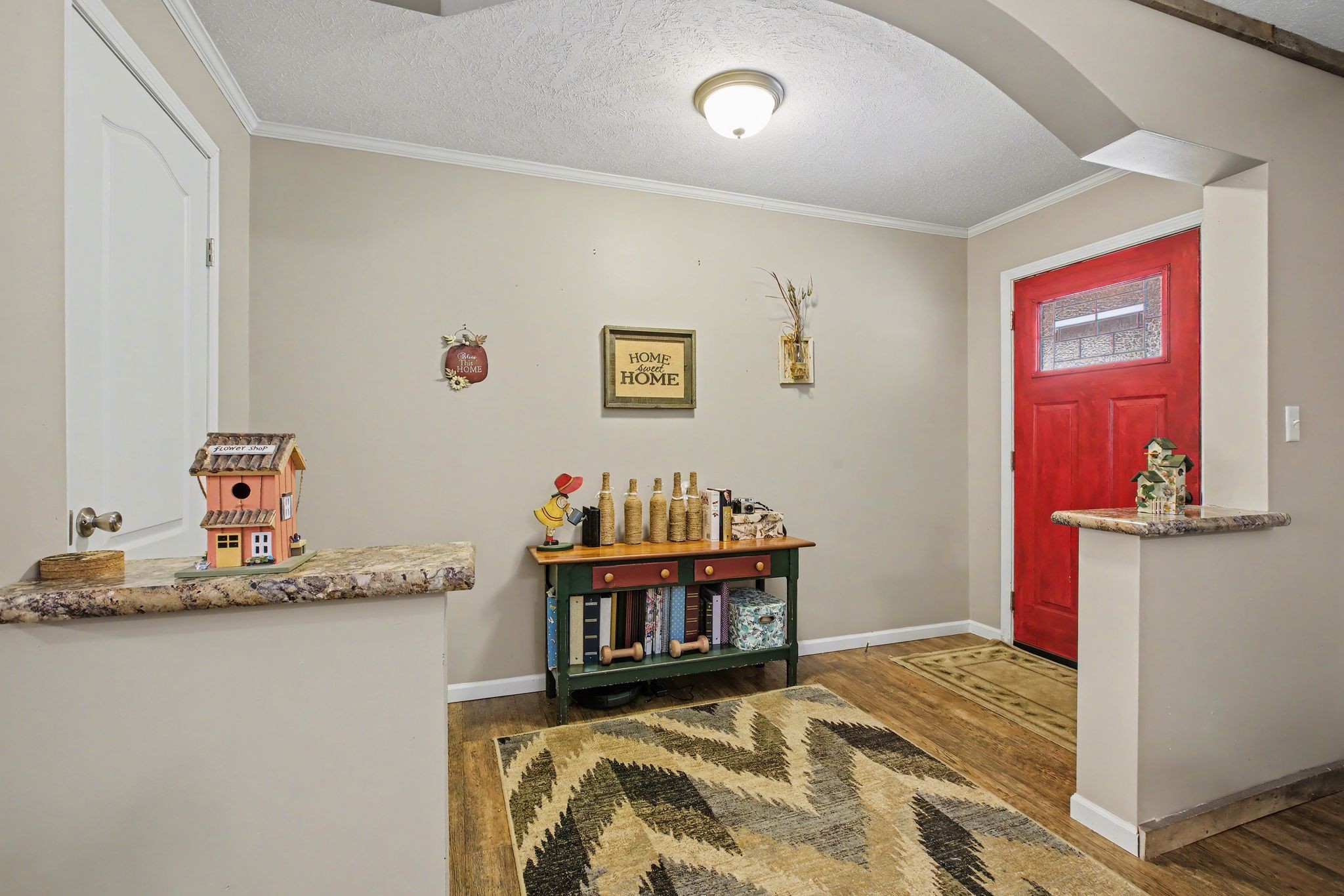 10878 Highway 7 Primm Springs, TN 38476 - Photo 17 of 37 a bedroom with a bed and a dresser in it