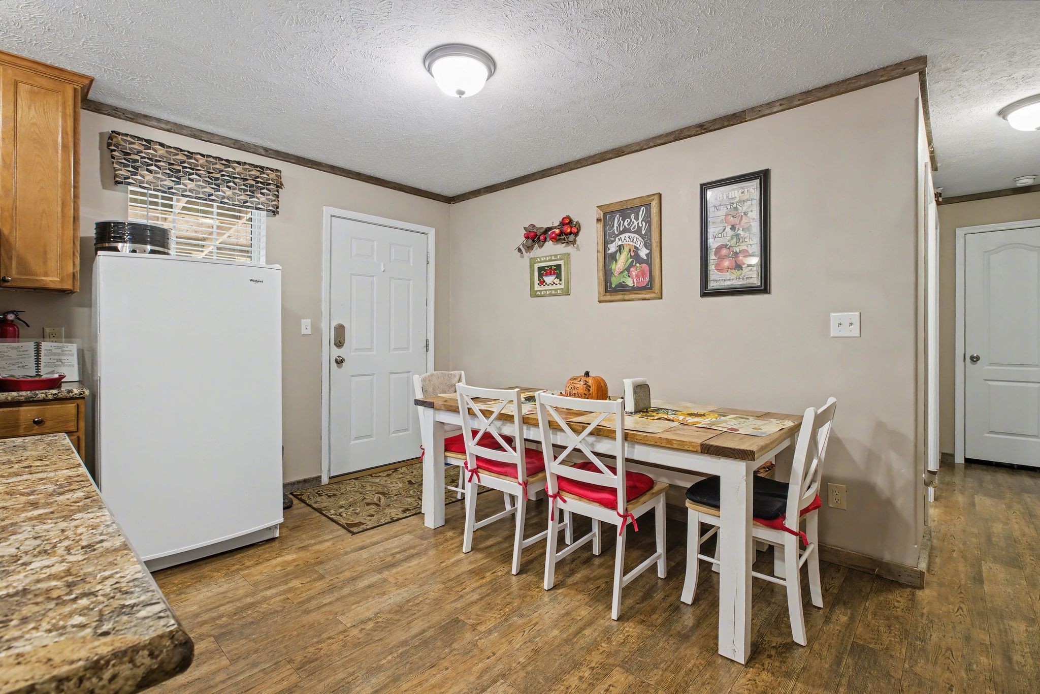 10878 Highway 7 Primm Springs, TN 38476 - Photo 24 of 37 a view of a dining room with furniture and wooden floor
