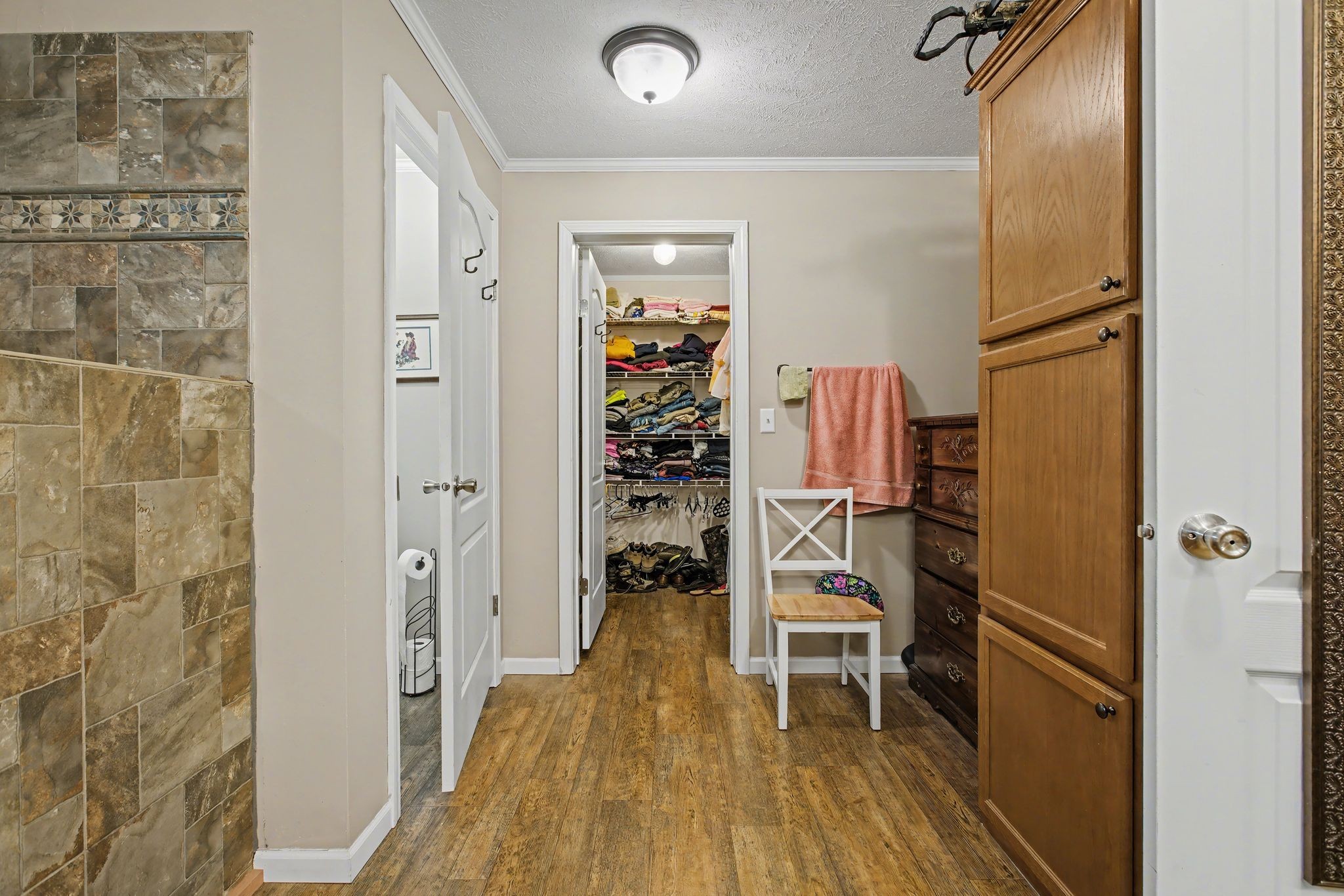 10878 Highway 7 Primm Springs, TN 38476 - Photo 30 of 37 a view of a hallway with wooden floor and entryway