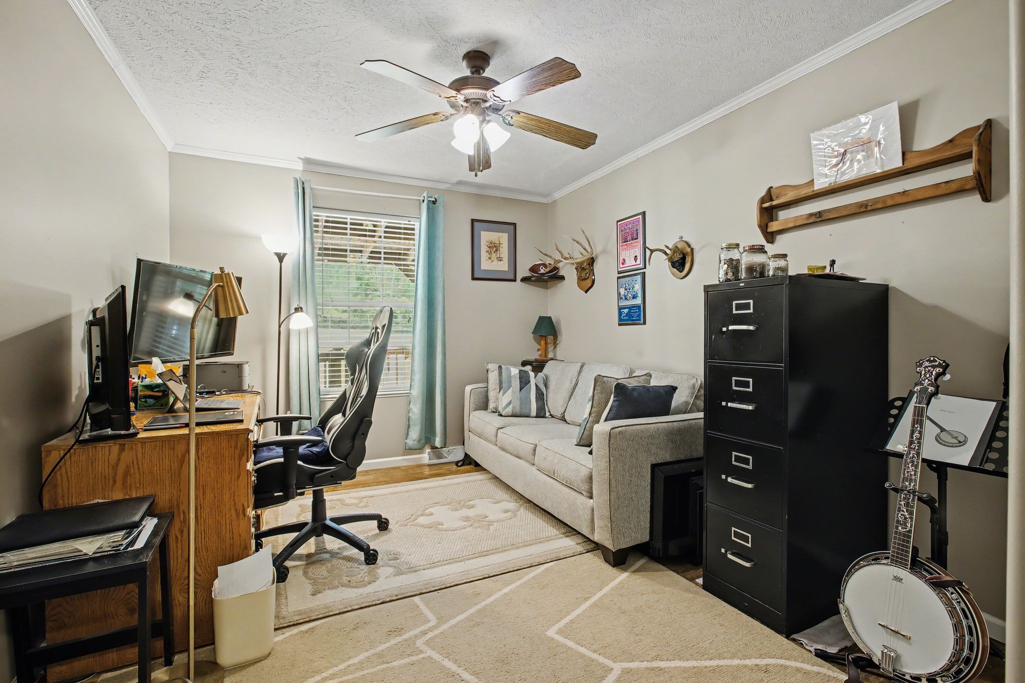 10878 Highway 7 Primm Springs, TN 38476 - Photo 32 of 37 a view of a workspace with furniture and a window