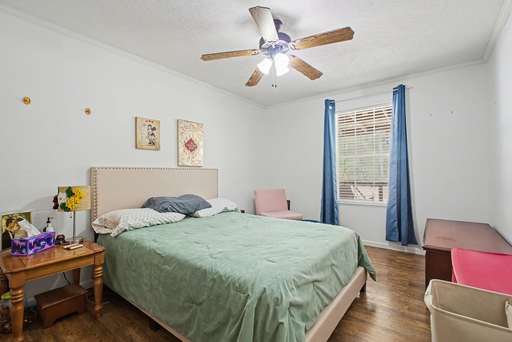 10878 Highway 7 Primm Springs, TN 38476 - Photo 33 of 37 a bedroom with a bed and a chandelier