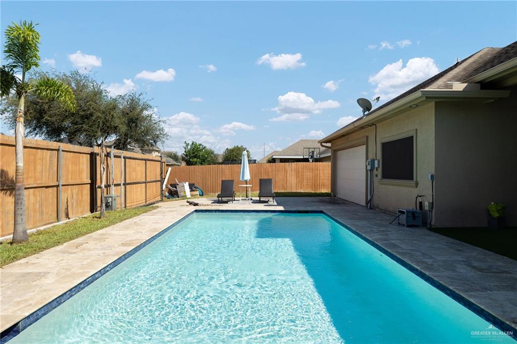 1202 Hummingbird Drive Pharr, TX 78577 - Photo 18 of 23 a view of a backyard with swimming pool