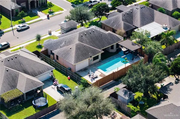 an aerial view of houses with outdoor space