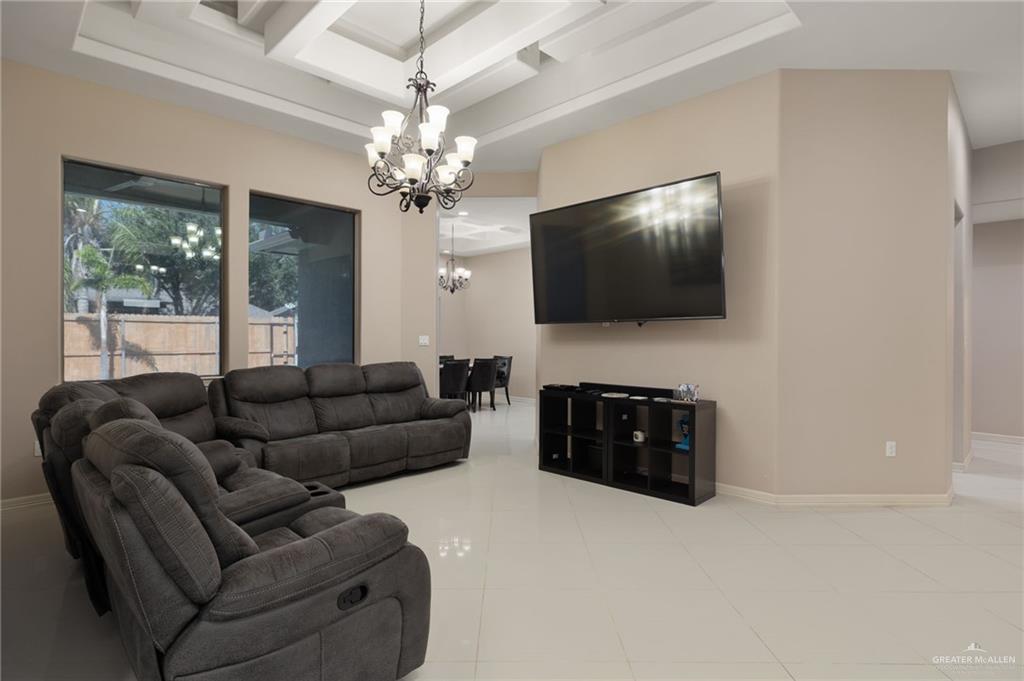 1202 Hummingbird Drive Pharr, TX 78577 - Photo 3 of 23 a living room with furniture and a flat screen tv